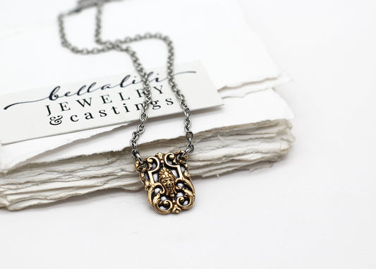 the Archivist, Sterling and Antique brass Necklaces